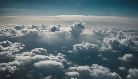 Clouds and sky as seen through window of an aircraft, view from aboveの素材