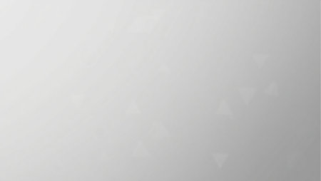 A blurry gray background with a few white circles. The background is mostly gray with some whiteの素材