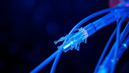 network cables close up with fiber optical network cable in blue light backgroundの素材