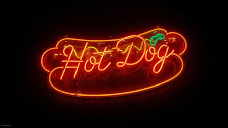 Neon sign in the form of a lettering on a black backgroundの素材