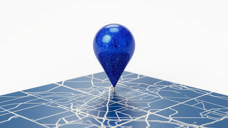Modern 3D illustration of a stylized map featuring a prominent blue location pin marker placed at the center. The map is rendered in shades of blue with white lines representing streets or pathways, creating a clean and digital aesthetic. The central location pin suggests a point of interest, destination, or user position, making this image ideal for themes related to navigation, GPS technology, geolocation services, and travel planning.の素材