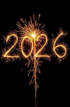 Happy new year 2026 written with Sparkle firework isolated on black backgroundの素材
