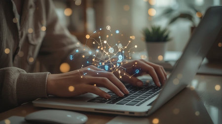 Businessman working on laptop in modern office. Network concept. Double exposureの素材