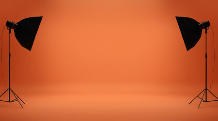 Studio light equipment on orange background. 3D rendering. Mockupの素材