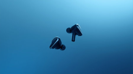 3d rendering of a pair of headphones on a blue background.の素材