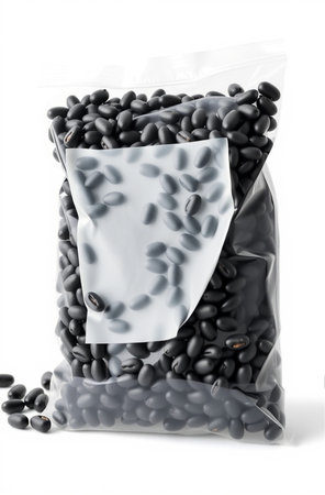 Black beans in plastic bag isolated on white background with clipping path.の素材