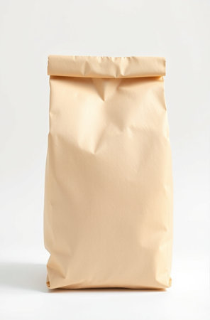 Brown paper bag isolated on a white background. Clipping path included.の素材