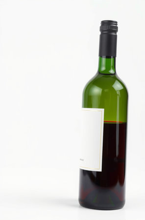 Bottle of red wine with blank label isolated on a white backgroundの素材