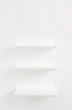 Empty white bookshelf on the white wall background, stock photoの素材