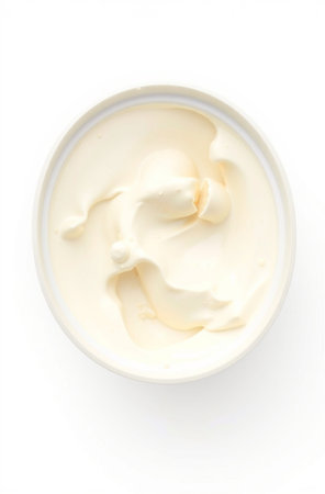 Creamy mayonnaise in a white bowl isolated on white backgroundの素材