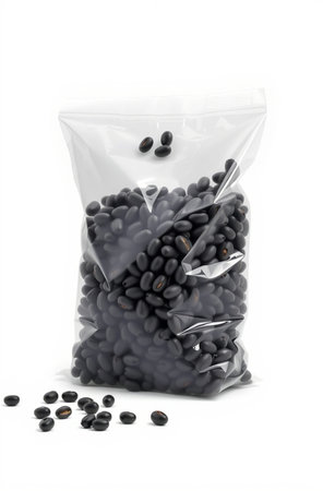 black beans in plastic bag isolated on white background with clipping path.の素材