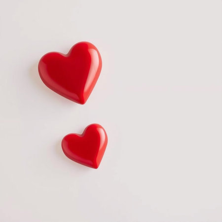 A vibrant red heart with a glossy, three-dimensional finish sits against a soft, light-colored...