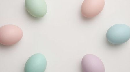 Colorful pastel easter eggs on white background with copy spaceの素材