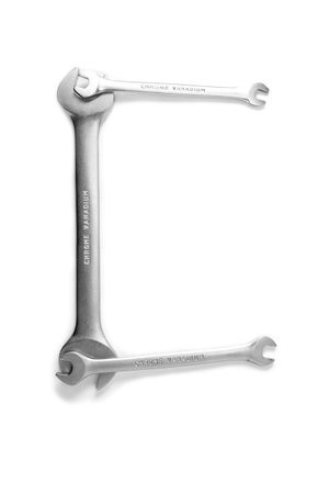 letters made of different size wranches isolated on white backgroundの写真素材