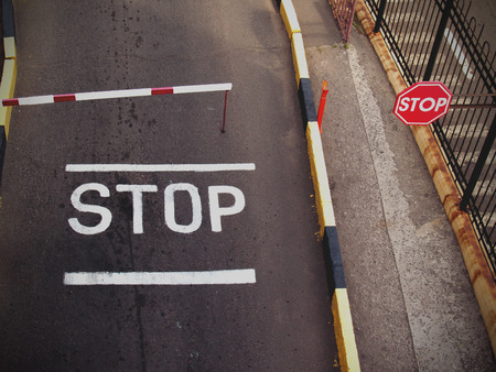 a stop sign painted on the roadの写真素材