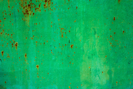 Pattern of old painted metal surface. Rusty metal, peeling paint, green tones, bright colors.の写真素材