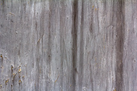 Abstract gray background with cracks, rust, horizontal and vertical stripesの写真素材