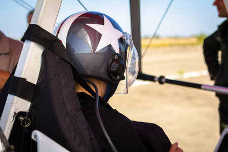 Paraglider pilot in hemlet, ready to flight closeup