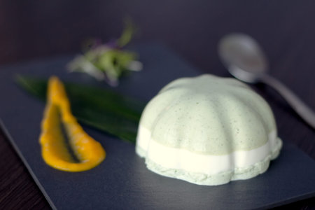 white jelly served in oriental style on a black plate