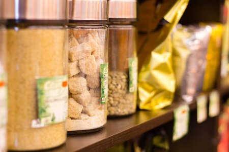 The packs of coffee are on the shelves in the store, close-up
