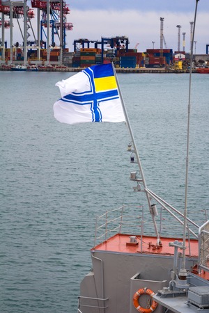 Odesa, UKRAINE - MARCH, 26, 2015: Battleship docked at the harbor with Ukrainian navy flag.のeditorial素材