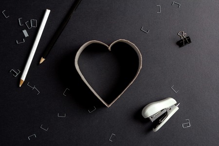 Heart made up of cardboard letters on black mate backgroundの写真素材