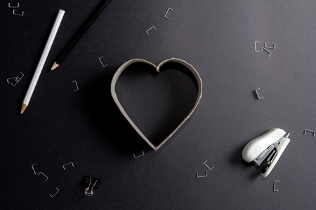 Heart made up of cardboard letters on black mate backgroundの写真素材