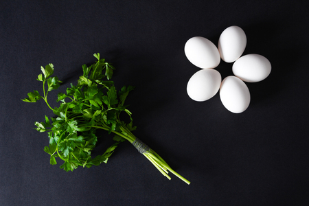 Several eggs on a black background. Top viewの写真素材