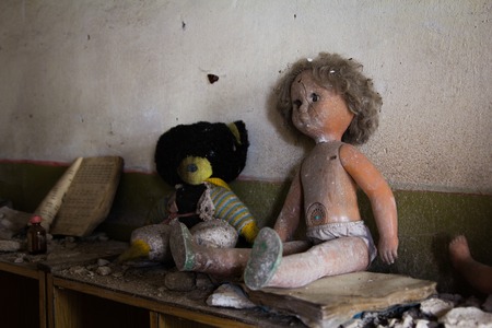 Old abandoned dolls in the abandoned kindergartenの写真素材