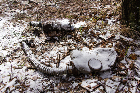 old mask snowbound lying on the groundの写真素材