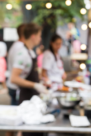 chef is cooking meat on the street food eventの写真素材