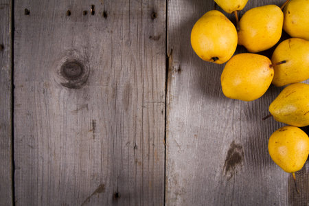 Juicy pears, fresh ripe organic pears on rustic wooden table, natural background, organic pears,...