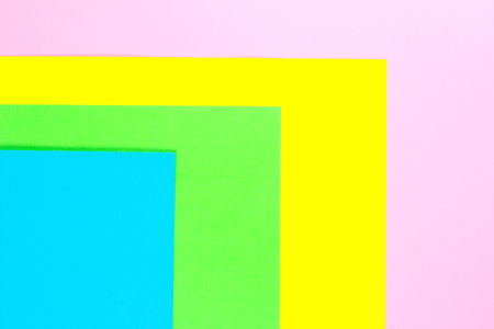 Material design yellow, blue, pink and green paper background. Photo.の写真素材