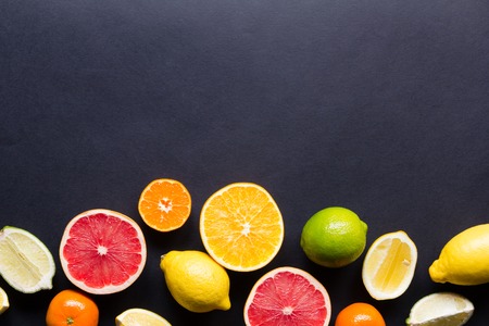 various types of citrus fruit on a dark backgroundの写真素材