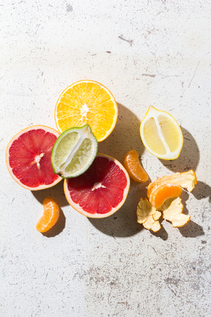 different kinds of citrus on white backgroundの写真素材