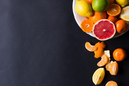 various types of citrus fruit on a dark backgroundの写真素材