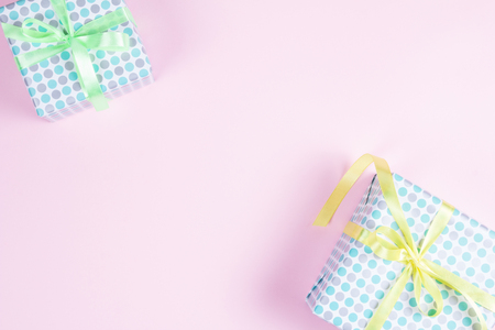 two elegant gift boxes on a pink background. View from above. Space for textの写真素材