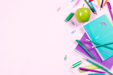 School stationery on pink background with copyspaceの写真素材