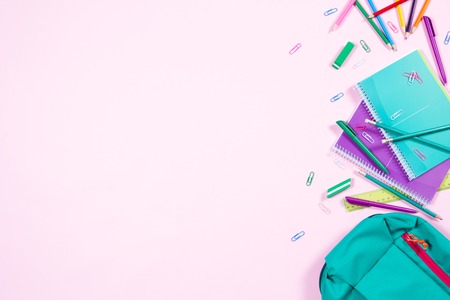 School stationery on pink background with copyspaceの写真素材