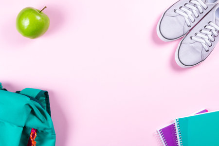 School stationery on pink background with copyspaceの写真素材