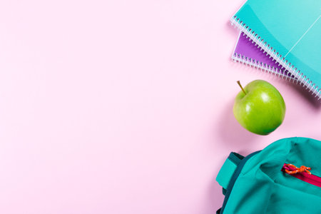 School stationery on pink background with copyspaceの写真素材