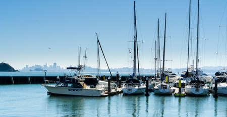 Tiburon, CA, USA - March 7, 2015: Boats docked at the Tiburon Marina with San Francisco in the background.のeditorial素材