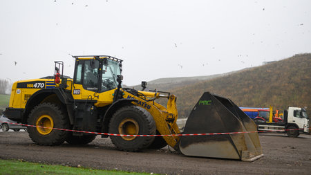 Riga, Latvia, November 15, 2022: Bulldozer equipment at waste processing siteのeditorial素材