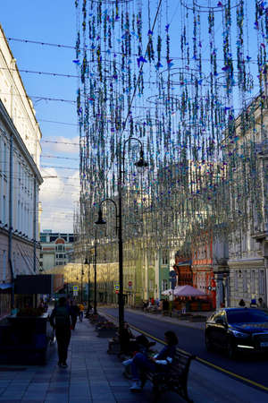 Moscow, Russia - August 17, 2020: Beautiful historical cultural center of Moscow of Nikolskaya street with illumination and walking tourists Street photo viewのeditorial素材