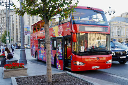 Moscow, Russia - August 2020: Red tour bus on the streets in central Moscow A double decker bus parked on the side of a building. Visiting sightseeingのeditorial素材