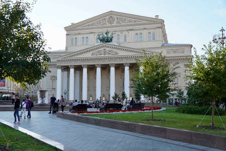 Moscow, Russia - August 2020: Beautiful summer view of the Bolshoi Theatre with tourists in the center of Moscow, the main attractions of Russia, Summer landscape with blooming flowerbedsのeditorial素材
