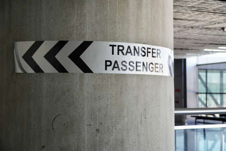 Pointer Plate Sign: Transfer passengers in the Airportの写真素材
