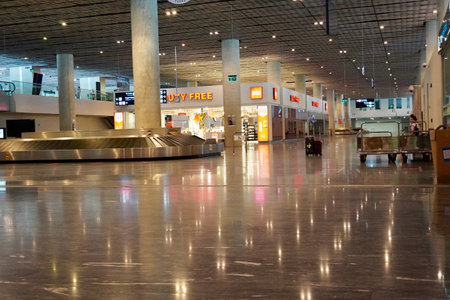 Bodrum, Turkey - August, 2020: Arrivals hall with glittering store windows of Duty Free stores at...