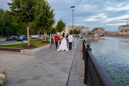 Beautiful panoramic view on the Moscow River Embankment with beautiful fountains and authentic houses on the opposite bank of the river. Architecture and landmarks of Moscow.のeditorial素材
