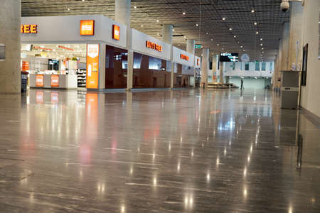 Bodrum, Turkey - August, 2020: Arrivals hall with shining windows of Duty Free stores Bodrum Airportのeditorial素材